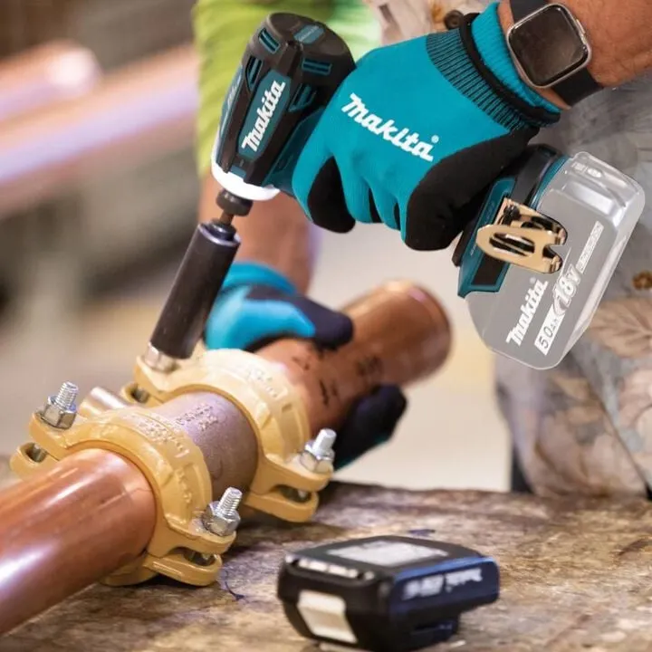 Makita XDT19 impact driver in use for fastening