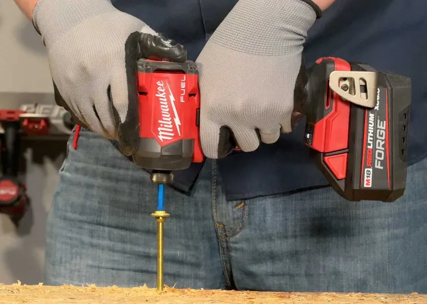 Milwaukee 2953-20 impact driver driving a screw